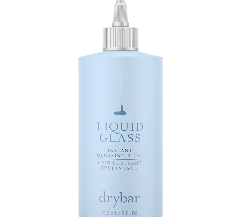 The Drybar Liquid Glass Instant Glossing Rinse comes in a light blue 236 mL (8 fl oz) bottle with a precision nozzle cap, providing salon-quality shine.