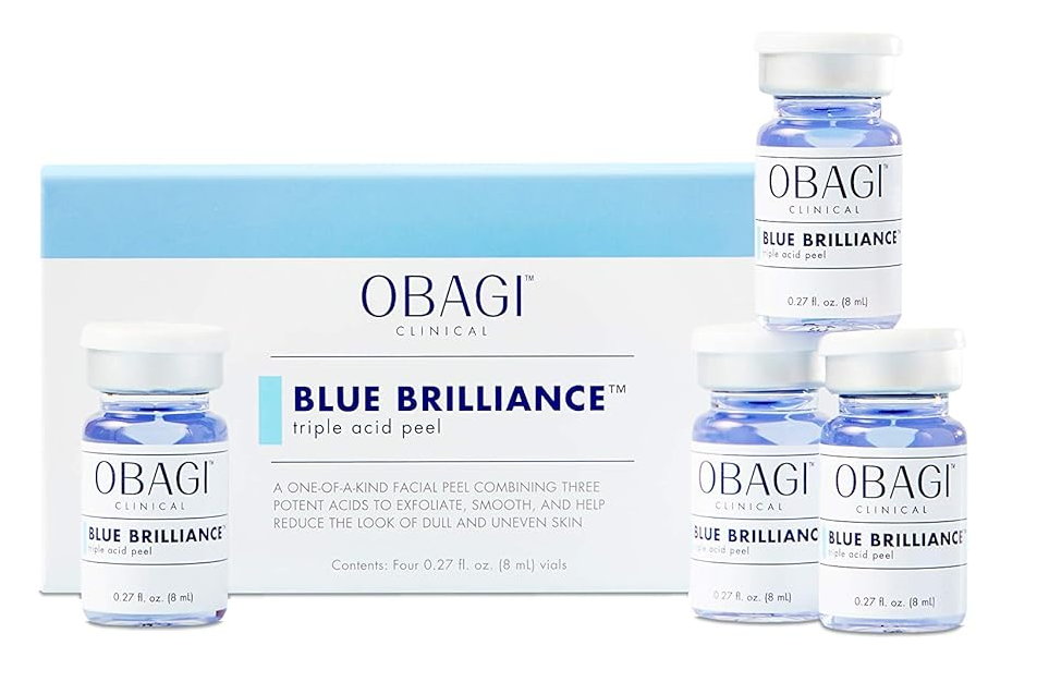 Image of the Obagi Clinical Blue Brilliance Triple Acid Peel 4 Piece Kit (0.27 Fl Oz Per Vial) packaging. The at-home peel kit features a blue and white box along with four small vials containing a blue liquid, designed to exfoliate and enhance skin texture.