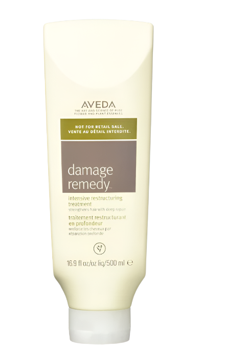 A tube of beige Aveda Damage Remedy Intensive Treatment, labeled as not-for-retail sale, contains 16 oz / 500 ml of product.