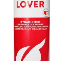 A 16.9 oz bottle of Framesi Color Lover Dynamic Red Shampoo, specially formulated for color-treated hair. This white bottle features a distinctive red label adorned with a white leaf design, ideal for preserving vibrant red hues.