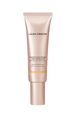 A tube of Tinted Moisturizer Light Revealer Natural Skin Illuminator Broad Spectrum SPF 25 from Laura Mercier. It comes in a metallic pink package with black text detailing features such as the natural skin illuminator and broad spectrum protection.